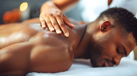 A man receiving a back massage at a spa representing relaxation and selfcare at a wellness center. Concept Relaxation techniques, Wellness centers, Massage therapy, Self-care activities