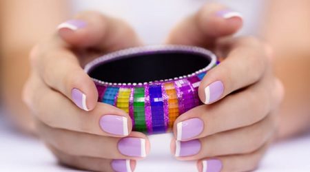 Bright Multi-Colored Bracelet In Woman's Hands