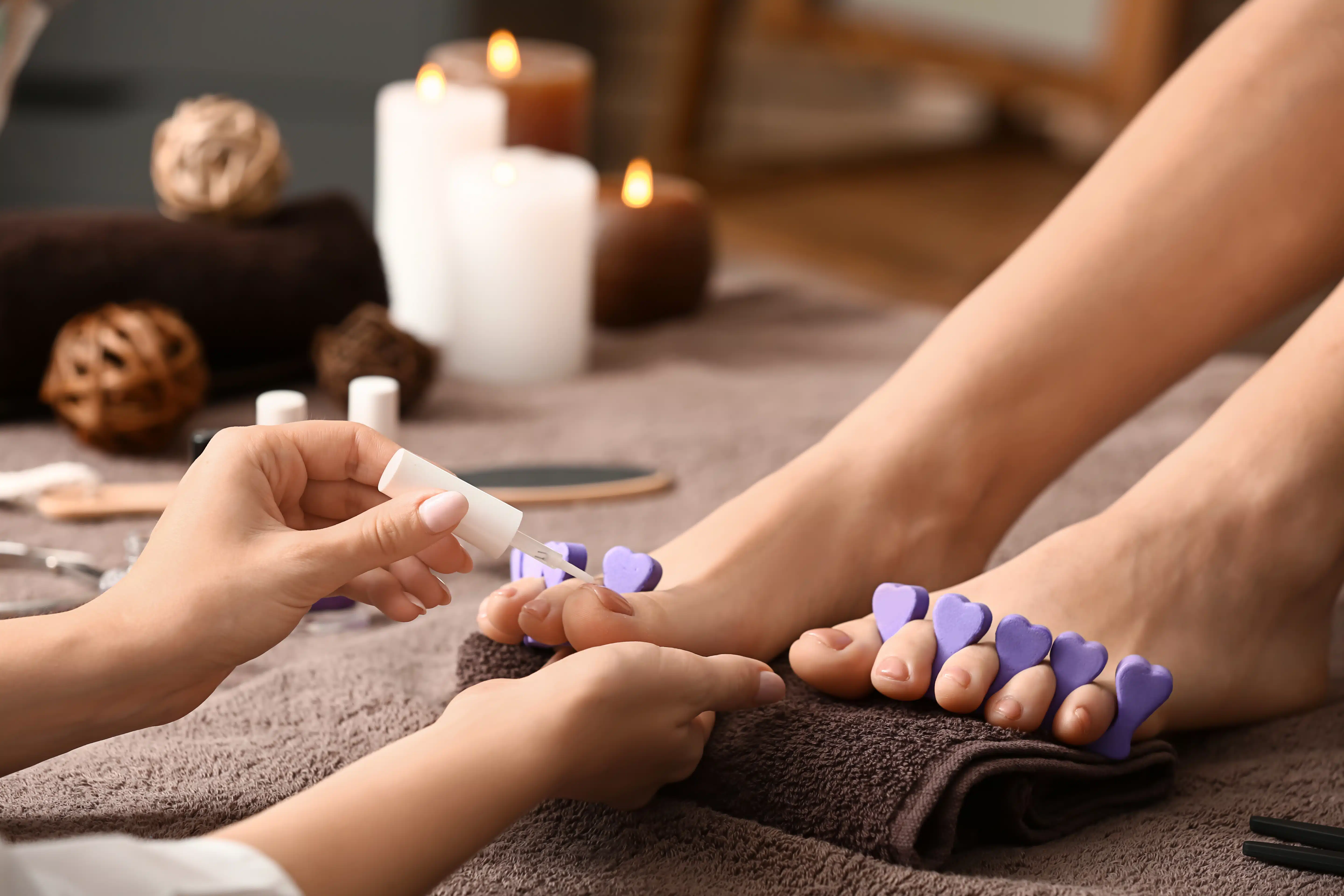 Young woman getting pedicure